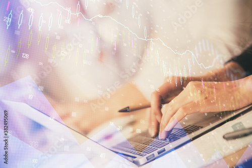 Double exposure of woman hands typing on computer and forex chart hologram drawing. Stock market invest concept.