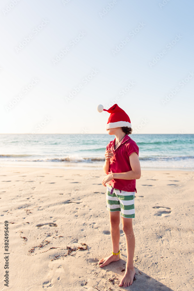 Child playing at the beach at Christmas time in Australia Child playing at the beach at Christmas time in Australia
