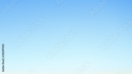 sky background captured in the early morning, sky view in blue natural colors with gradient, sky texture without clouds, space colors, defocus