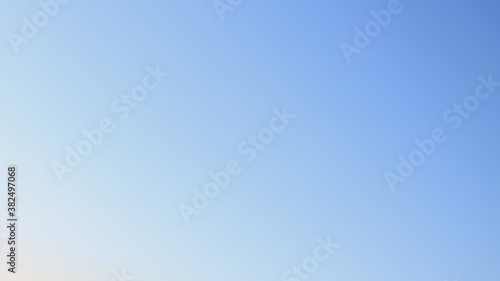 sky background captured in the morning, sky view in blue natural colors with gradient, sky texture without clouds, black, atmosphere, space colors, defocus © Aliaksandra