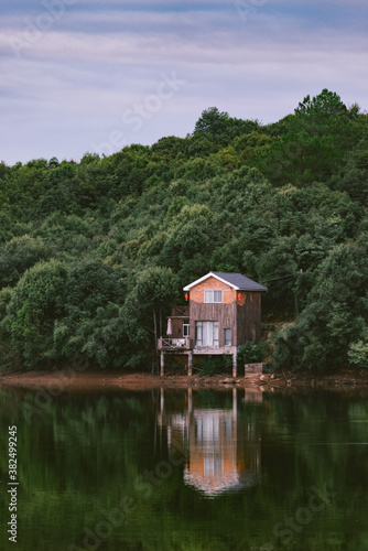 woodhouse infront of lake photo