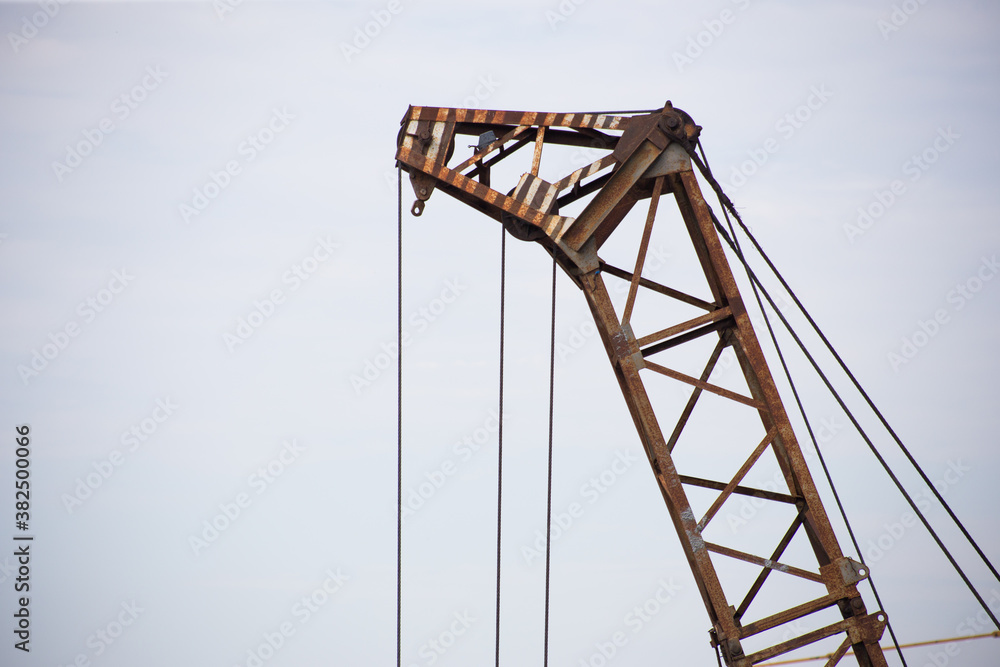 Tower crane at a construction site in the city Tower crane at a construction site in the city