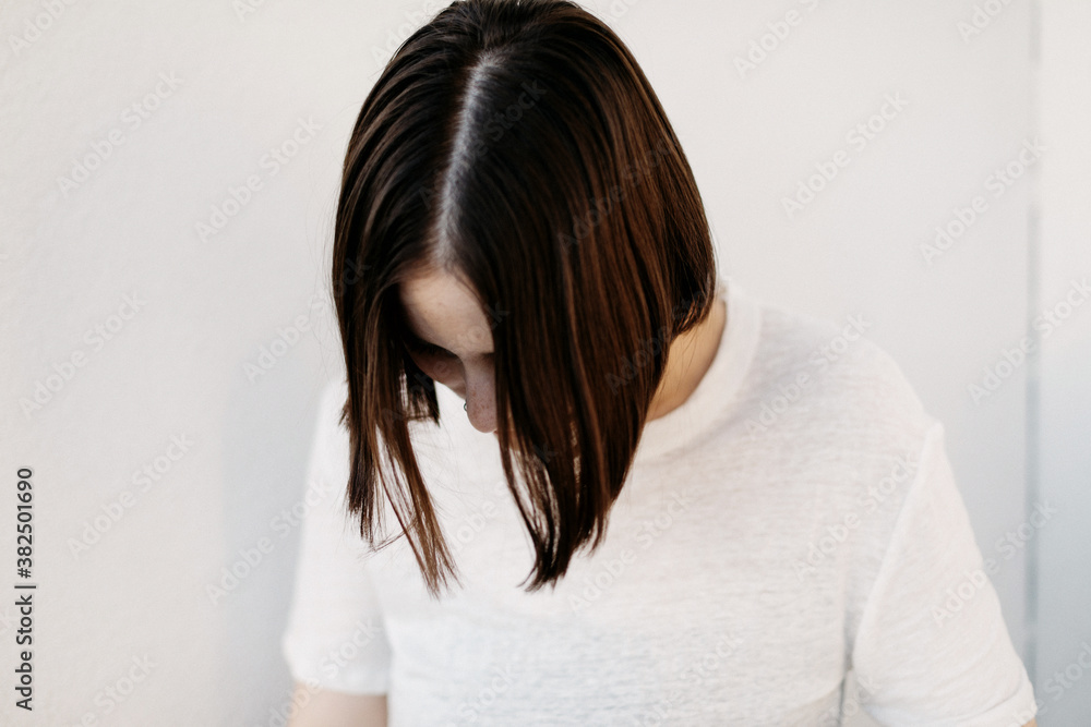 Girl with white shirt tucked in black jeans Girl with white shirt tucked in black jeans