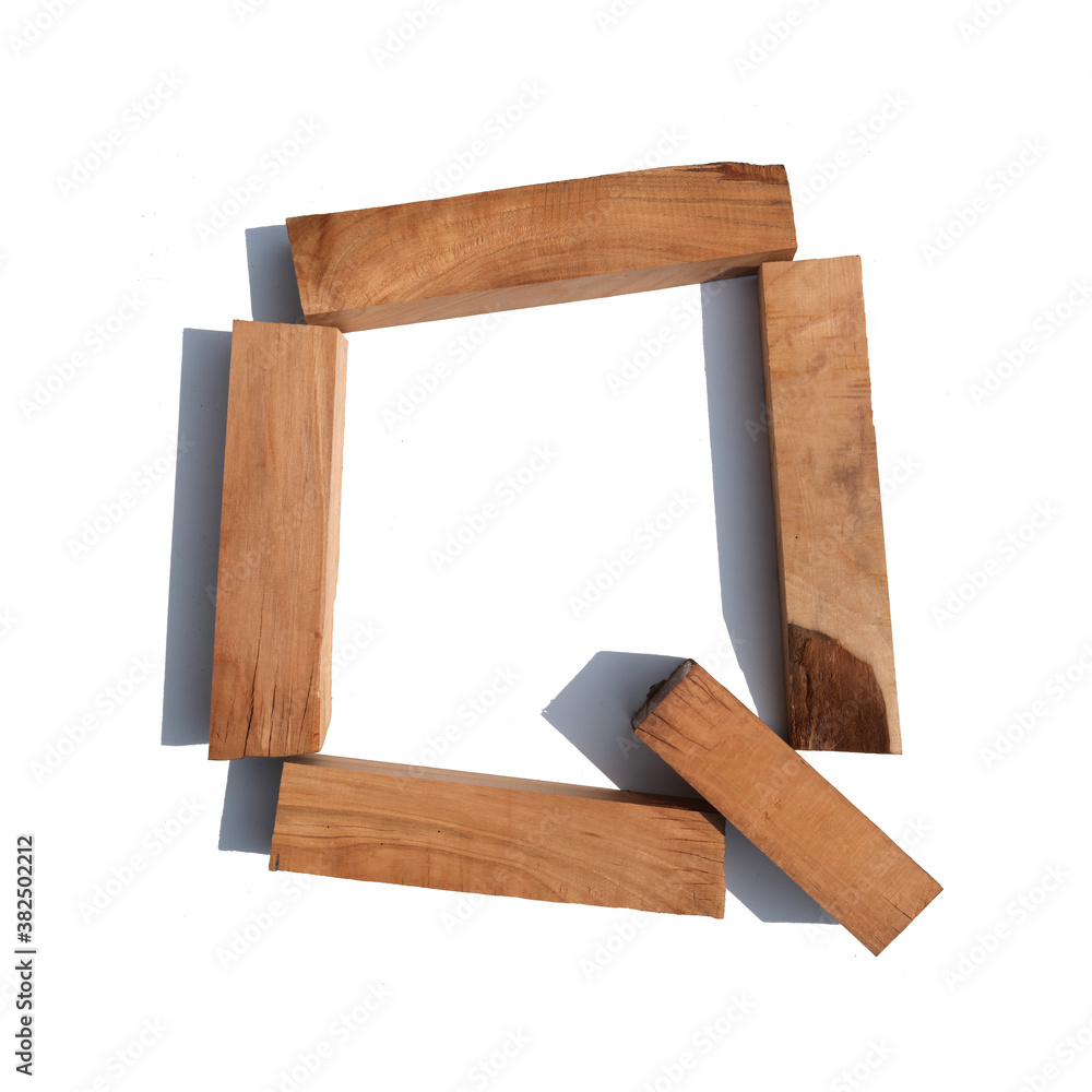 The letter Q made of wood blocks on a white background board The letter Q made of wood blocks on a white background board