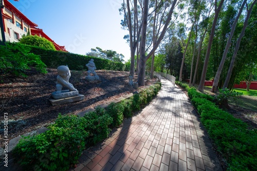 Beautifully vibrant colourful and Landscaped Gardens in a Buddhist temple in Wollongong NSW Australia photo