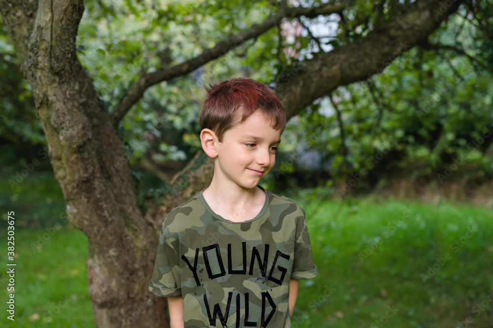 Portrait of a tween boy in a slogan t-shirt Portrait of a tween boy in a slogan t-shirt