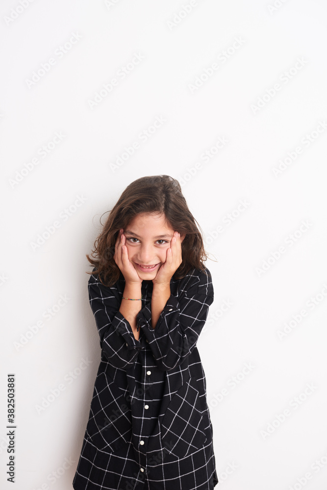 Child holding her face in her hands Child holding her face in her hands
