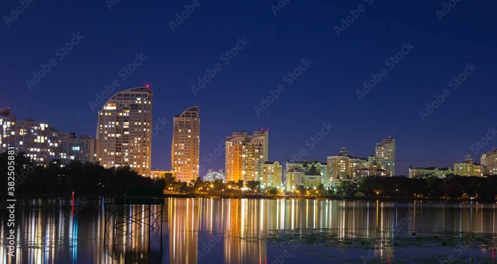 Bright night embankment on the banks of the Dnieper on Obolon Bright night embankment on the banks of the Dnieper on Obolon