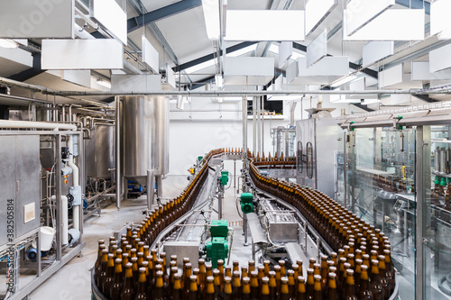 Beer bottles assembly line in a brewery factory