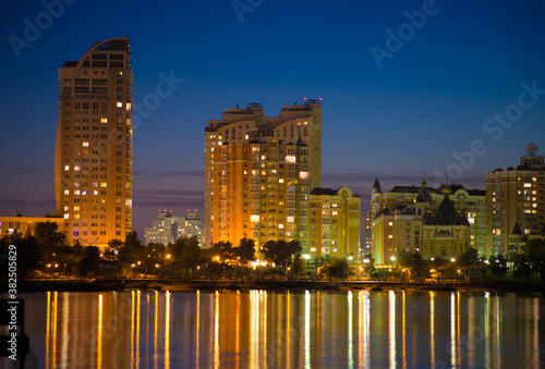 Bright night embankment on the banks of the Dnieper on Obolon