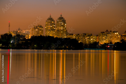 Bright night embankment on the banks of the Dnieper on Obolon