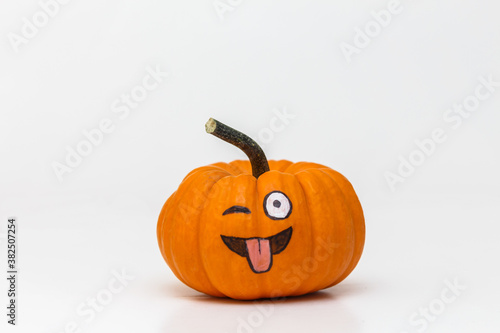 pumpkin with silly emoticon face