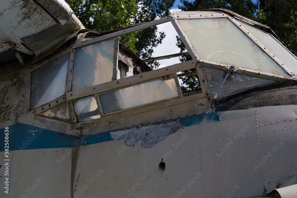 Old abandoned biplane in daylight
