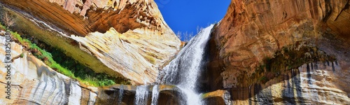 Lower Calf Creek Falls Waterfall colorful views from the hiking trail Grand Staircase Escalante National Monument between Boulder and Escalante in Southern Utah. United States. photo