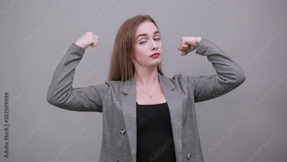 Feels proud have strength, shows great power, raises arms to show ...