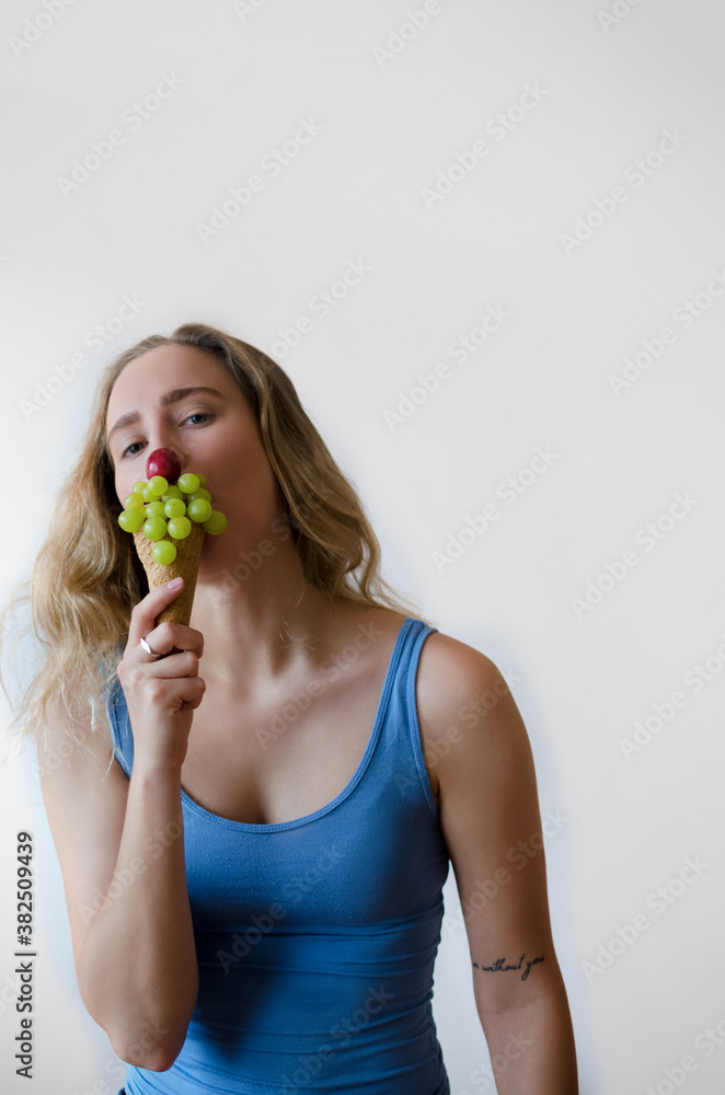 Young woman eating ice cream corn with fruits Young woman eating ice cream corn with fruits