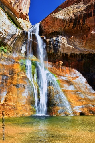 Lower Calf Creek Falls Waterfall colorful views from the hiking trail Grand Staircase Escalante National Monument between Boulder and Escalante in Southern Utah. United States.
