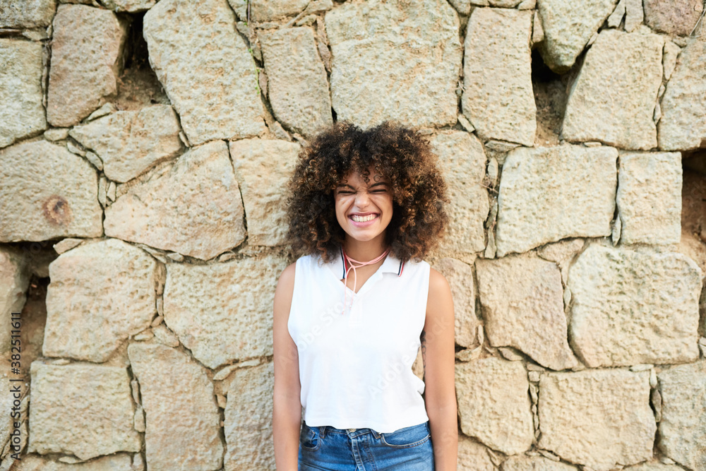 Attractive curly girl with charming smile. Attractive curly girl with charming smile.