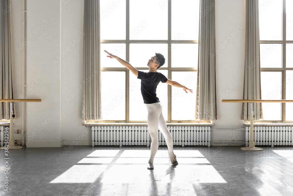Young professional male dancer practicing in a studio Young professional male dancer practicing in a studio