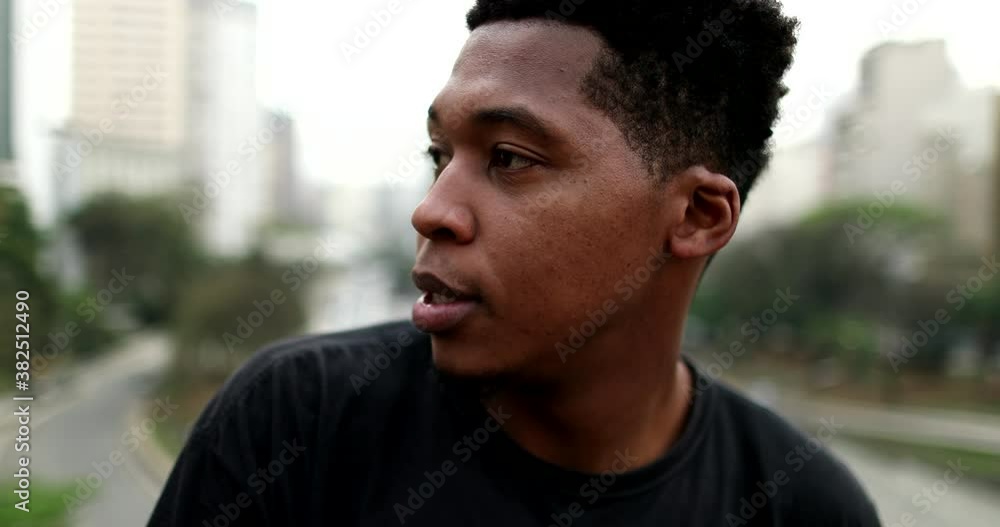 Pensive black African american man in city Pensive black African american man in city