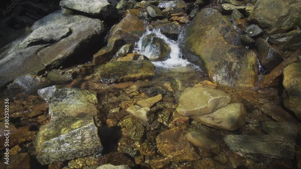 Small waterfall in the wild forest close-up. Small waterfall in the wild forest close-up.