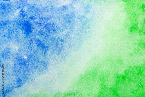 Watercolor painting on paper wallpaper. Hand painted blue and green watercolor background.