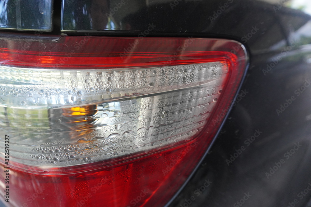 Rear lights of Black sport utility vehicle car there is a problem with water into rear lights or condensation in tail lights.