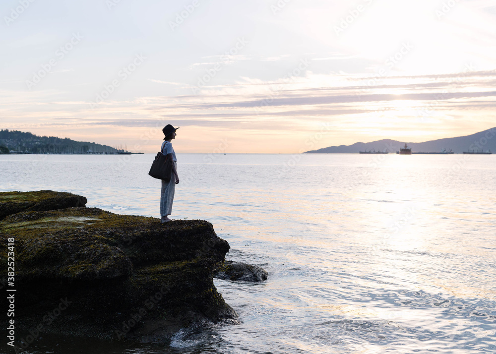Silhouette of girl by the beach during sunset Silhouette of girl by the beach during sunset