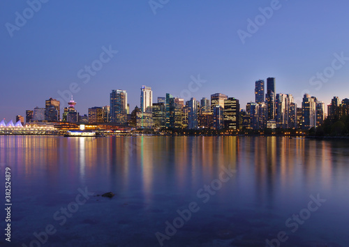 Blue hour cityscape view of Vancouver Downtown from the sea wall in Stanley Park © Jara
