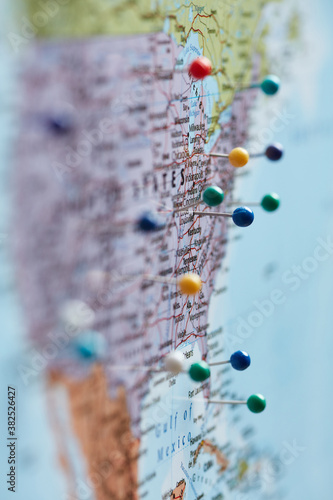 North America marked with colorful push pins. photo