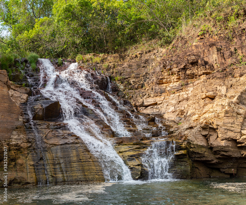 Naklejka premium waterfall view at Capitolio. One of the most popular tourism places in Minas Gerais near the Canastra mountain range. Boat ride attraction