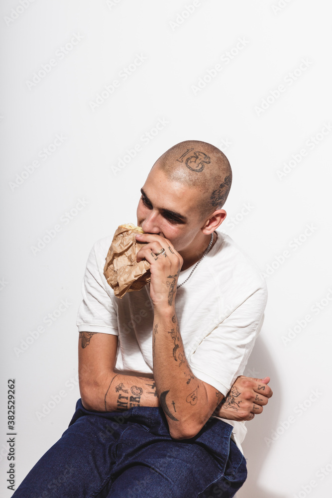 A guy eating a sandwich A guy eating a sandwich