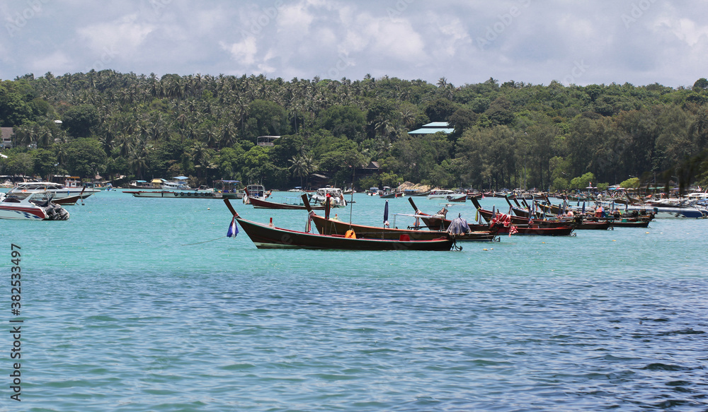 Idyllic crystal seawater in front of luxury hotel, attractive clear sea, nature coastline backgrounds during holidays, wave from clear blue green sea and fine sand Phuket Thailand toursim advertisemen