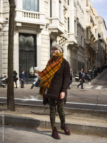 Woman with coffee in coat photo