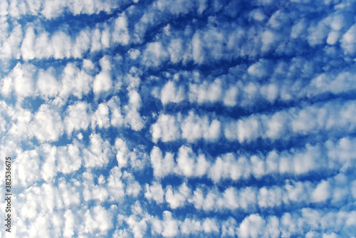 Blue sky with many fluffy white clouds