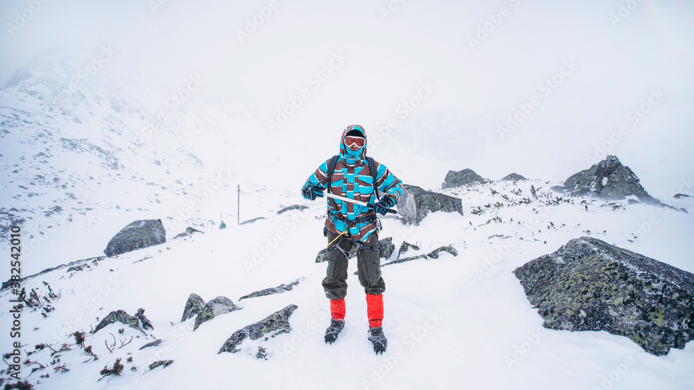 Full body shot of a hiker in mountains Full body shot of a hiker in mountains
