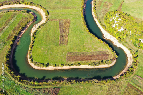 SEPTEMBER, 2020 - Aerial view of river Lika meandering through Donji Kosinj and Lipovo Polje villages in Croatia. photo