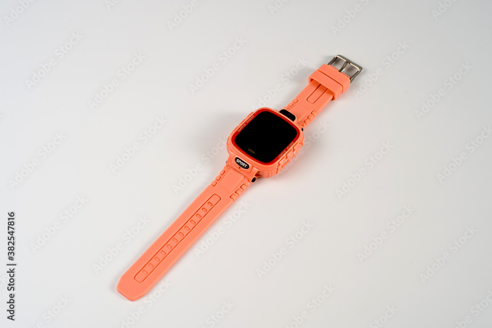 An electronic wristwatch of pink color with gps for teenagers and children. An electronic wristwatch of pink color with gps for teenagers and children.