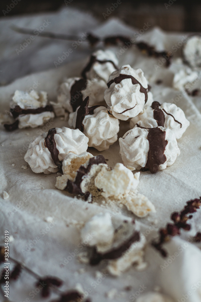 Meringue kisses on wooden table Meringue kisses on wooden table