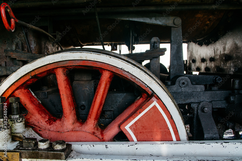 Driving wheel and connecting rod of an old steam locomotive Driving wheel and connecting rod of an old steam locomotive