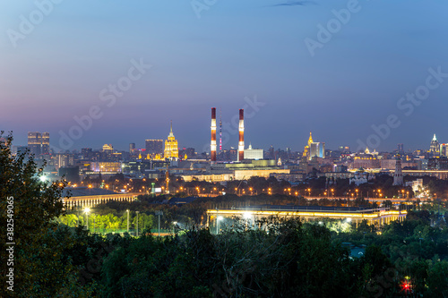 view of central Moscow from Sparrow Hills or Vorobyovy Gory observation (viewing) platform at sunset-- is on a steep bank 85 m above the Moskva river, or 200 m above sea level. Russia