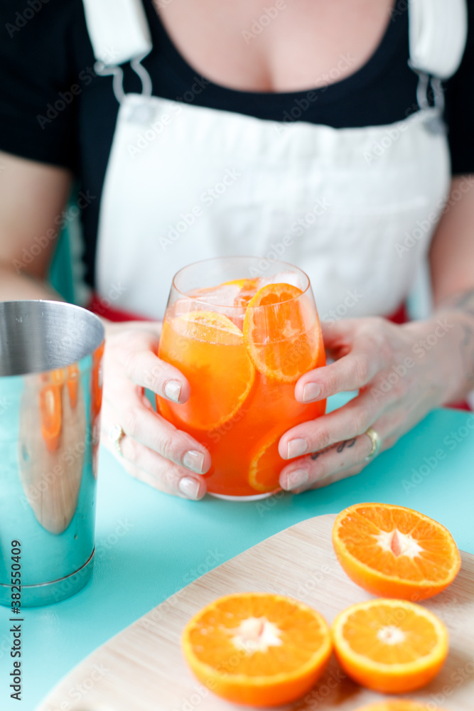 Hands holding a cocktail Hands holding a cocktail