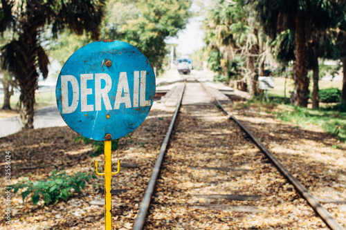 Derail warning sign on a railroad photo