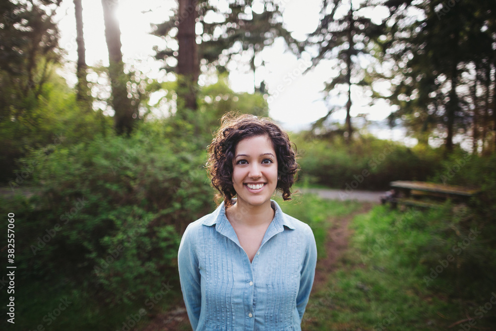 Portrait of young happy woman hanging out in nature - laughing in forest Portrait of young happy woman hanging out in nature - laughing in forest