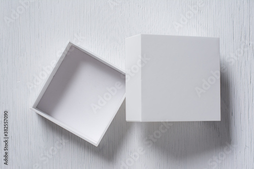 Cardboard box with cover on white table top view, Open gift box. © sek_gt