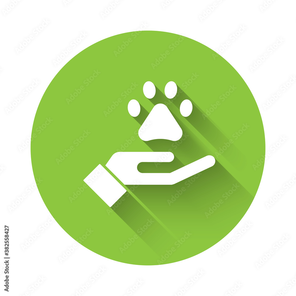 White Hands with animals footprint icon isolated with long shadow. Pet paw in heart. Love to the animals. Green circle button. Vector. White Hands with animals footprint icon isolated with long shadow. Pet paw in heart. Love to the animals. Green circle button. Vector.