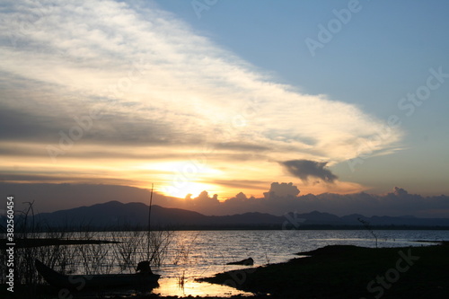 sunset over the lake in nation park  Beautiful rainforest landscape with fog in evening Thailand