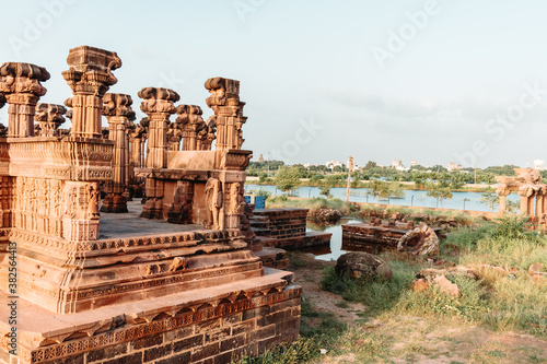scenic View of the columns of ancient historic place Chhatardi with clear blue sky at Bhuj, Gujarat, India.