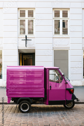 Pink three-wheeled light commercial vehicle photo