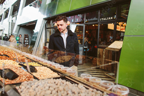 Young man shopping for groceries. photo